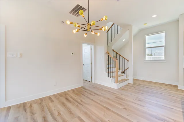 a view of an entryway with wooden floor