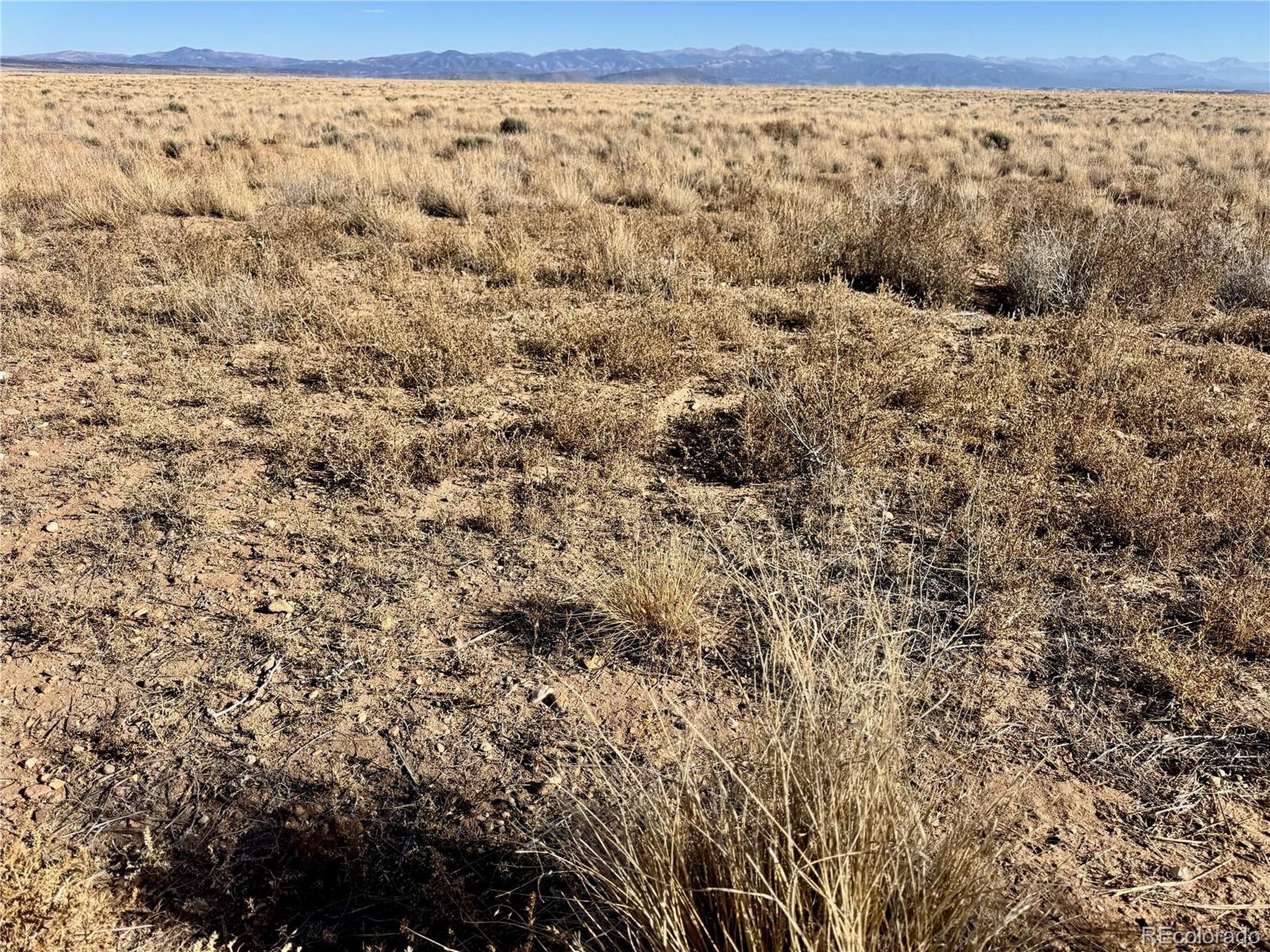 16 Fort Morgan Road Blanca, CO 81123 - Photo 10 of 13 a view of a dry yard with wooden fence