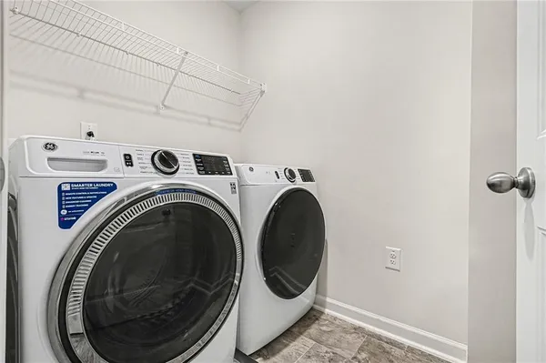 a utility room with dryer and washer