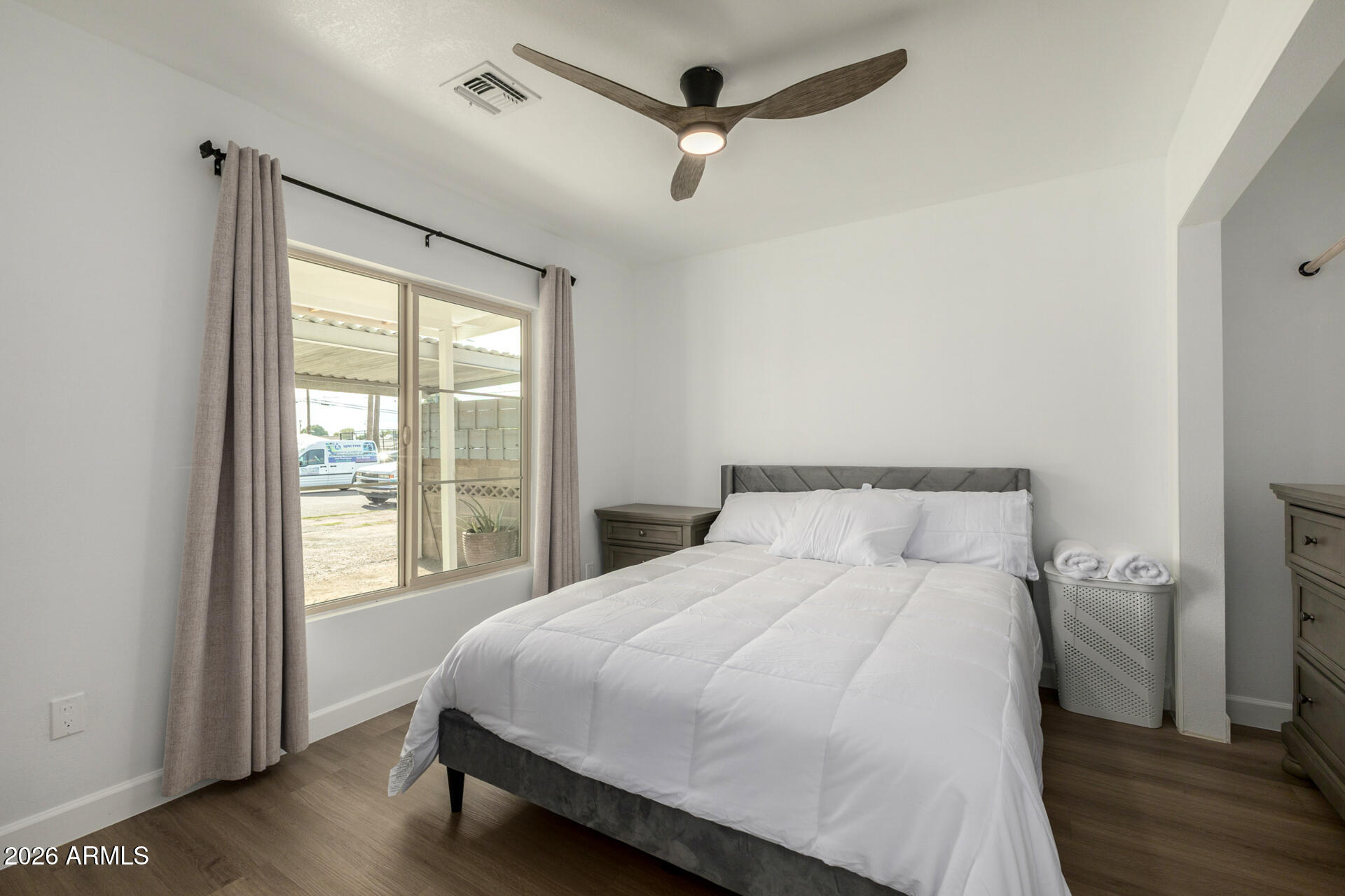 2142 West Coolidge Street Phoenix, AZ 85015 - Photo 12 of 28 a bedroom with a large bed and a window