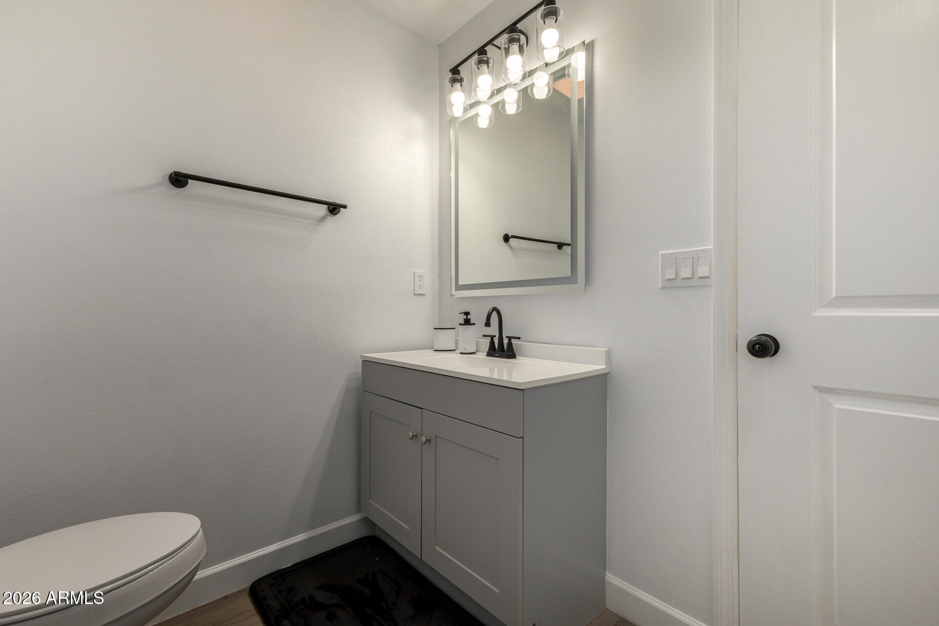 2142 West Coolidge Street Phoenix, AZ 85015 - Photo 17 of 28 a bathroom with a sink a toilet and shower