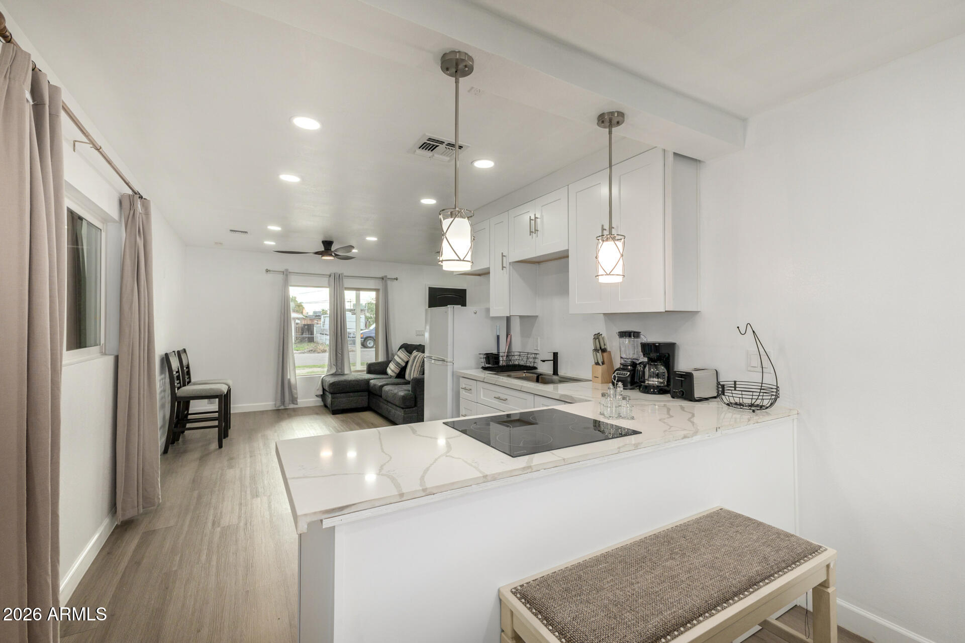 2142 West Coolidge Street Phoenix, AZ 85015 - Photo 19 of 28 a kitchen with a stove a refrigerator and a sink