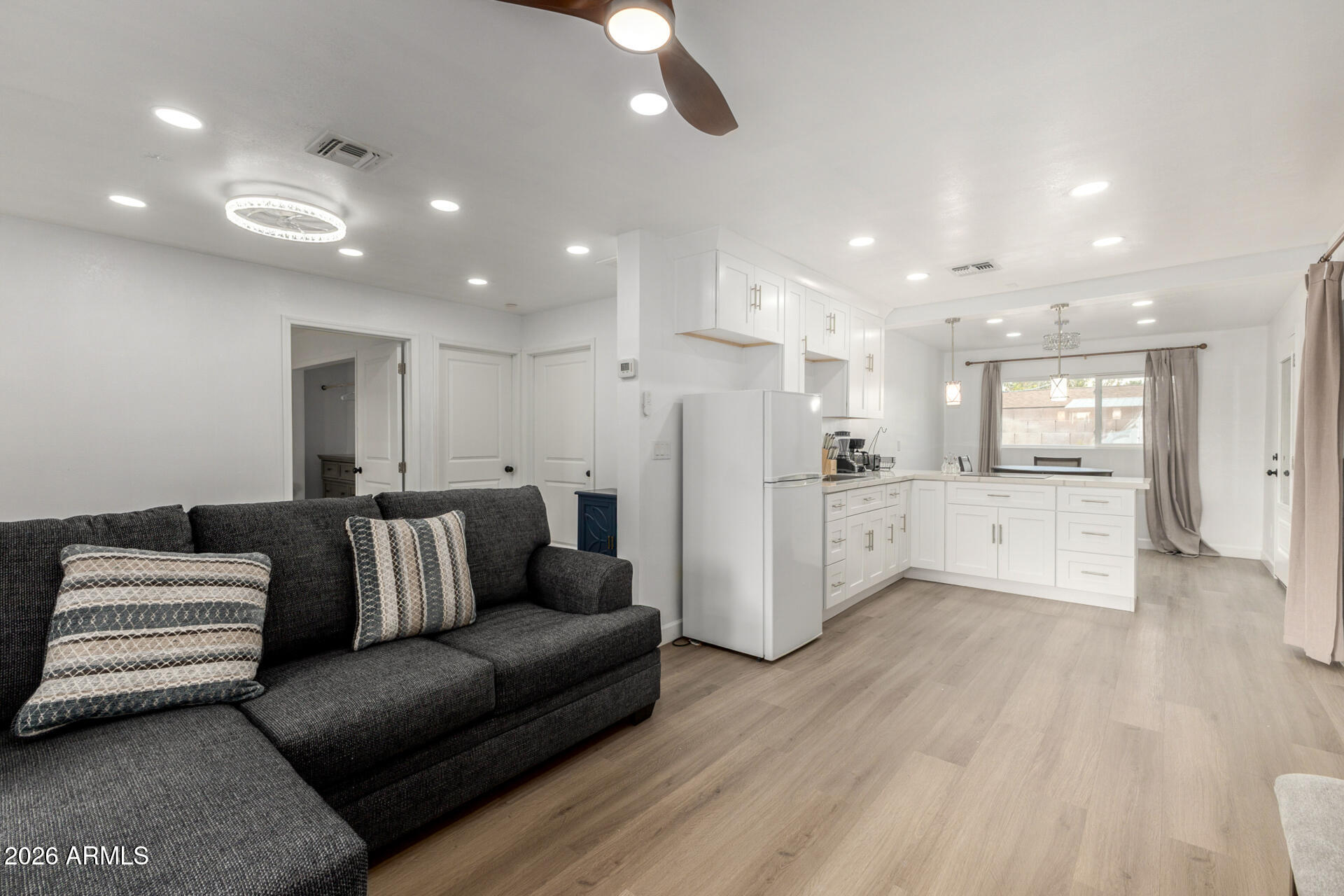 2142 West Coolidge Street Phoenix, AZ 85015 - Photo 26 of 28 a living room with furniture and kitchen view