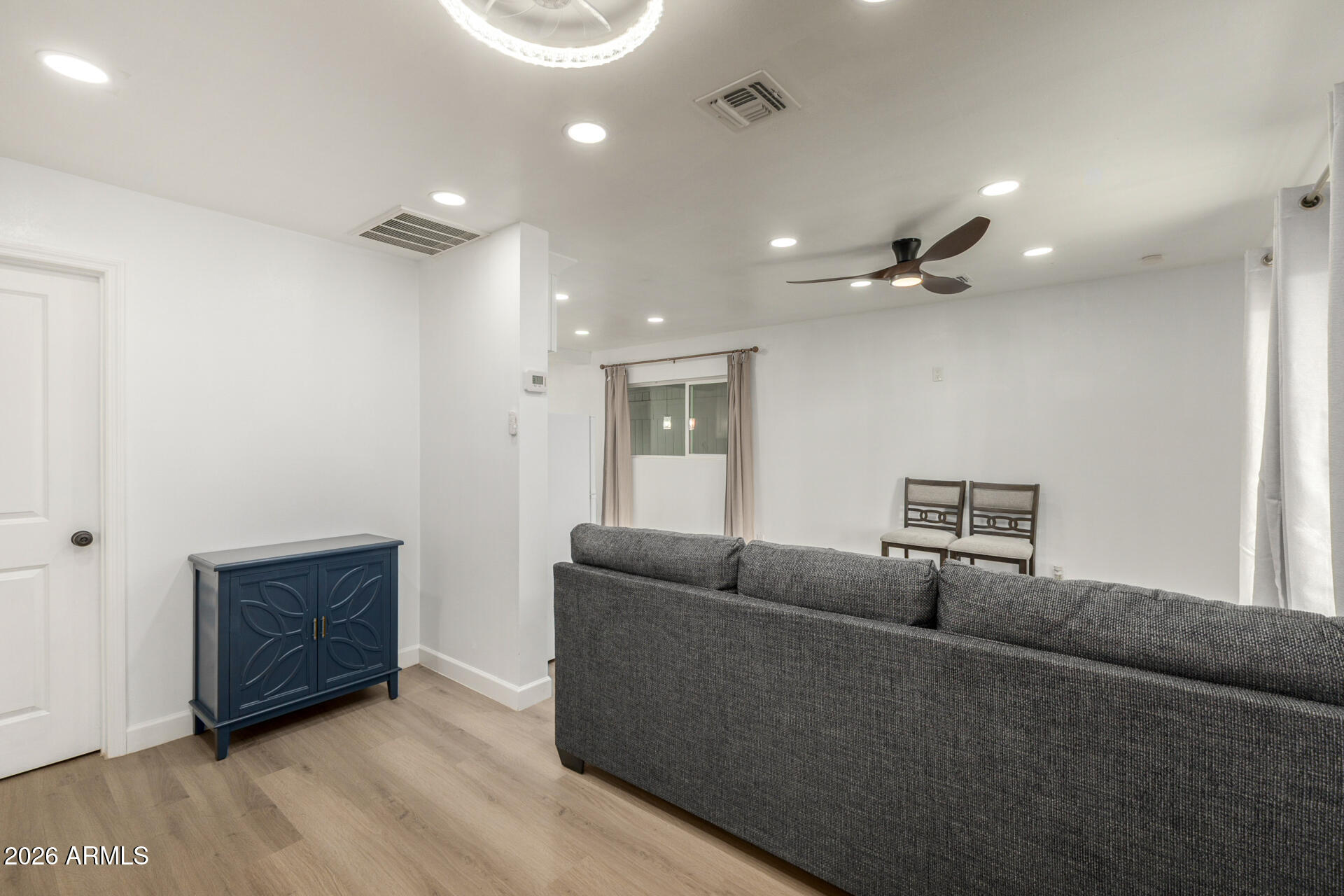 2142 West Coolidge Street Phoenix, AZ 85015 - Photo 27 of 28 a living room with furniture and a ceiling fan
