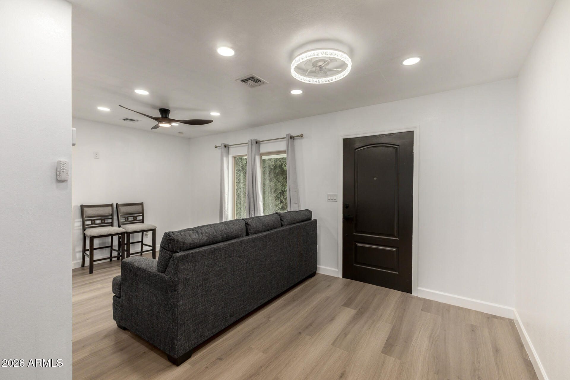 2142 West Coolidge Street Phoenix, AZ 85015 - Photo 28 of 28 a living room with furniture and a flat screen tv