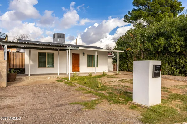 a house with trees in the background
