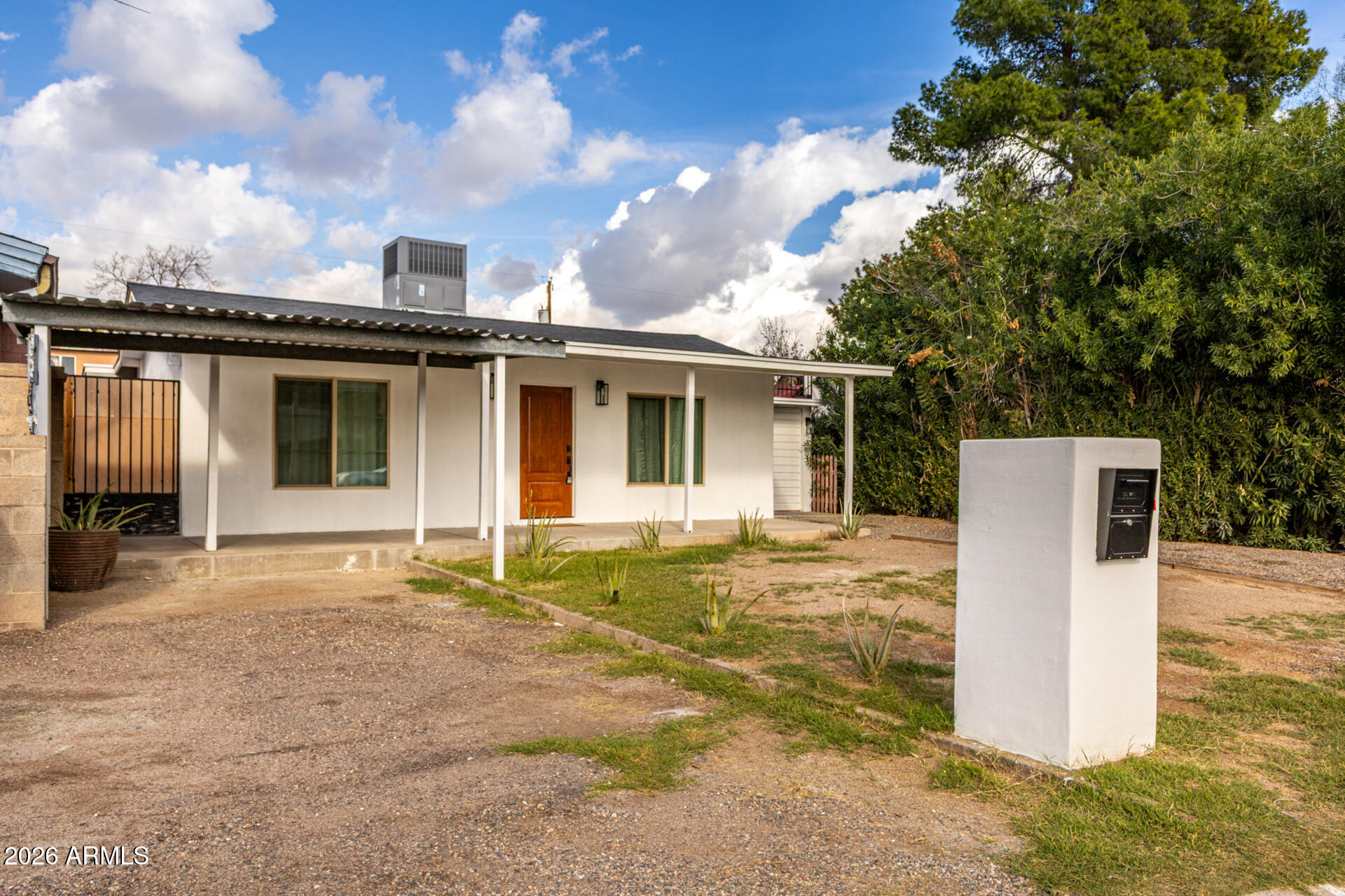 2142 West Coolidge Street Phoenix, AZ 85015 - Photo 3 of 28 a house with trees in the background