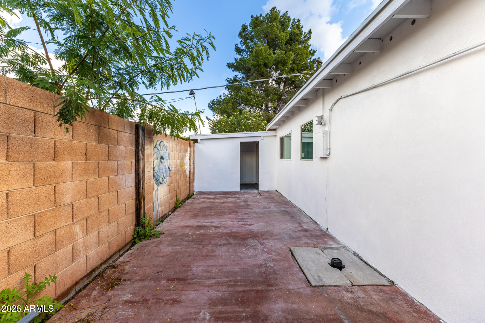 2142 West Coolidge Street Phoenix, AZ 85015 - Photo 4 of 28 a view of backyard with small cabin and wooden fence
