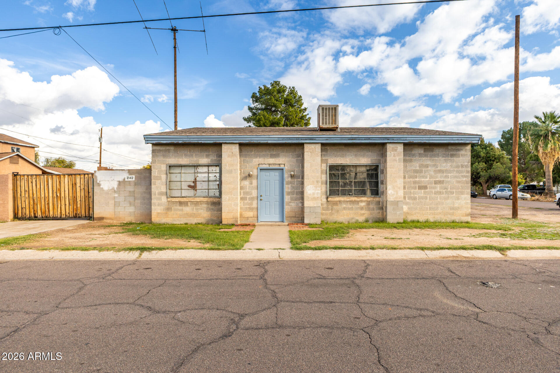 2142 West Coolidge Street Phoenix, AZ 85015 - Photo 7 of 28 a view of a house with a backyard and a garage