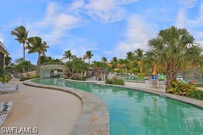 6650 Beach Resort Drive, Unit 908 Naples, FL 34114 - Photo 2 of 15 a view of a garden with a houses