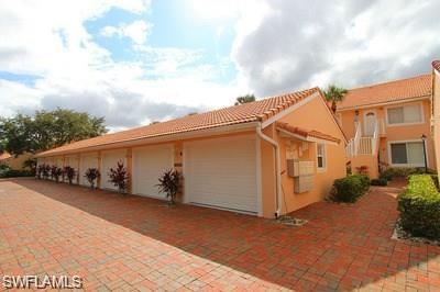 6650 Beach Resort Drive, Unit 908 Naples, FL 34114 - Photo 5 of 15 a view of a house with wooden fence