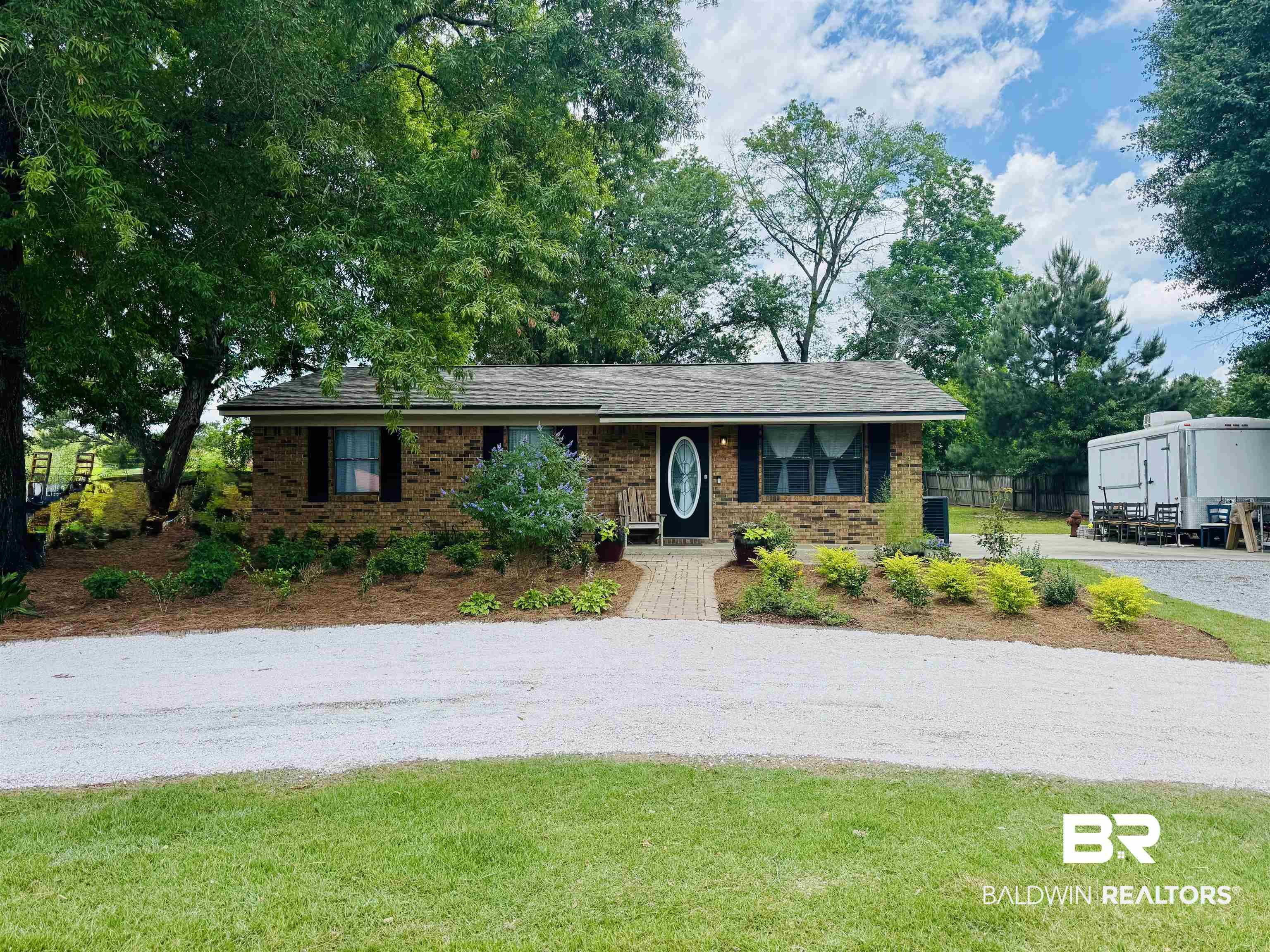 2274 Foshee Road Brewton, AL 36426 - Photo 1 of 23 View of front of house with driveway and brick siding