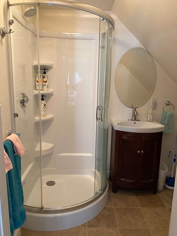 8 May Street Beverly, MA 01915 - Photo 17 of 25 a bathroom with a sink and a mirror