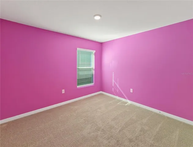 a very nice looking room with a projector