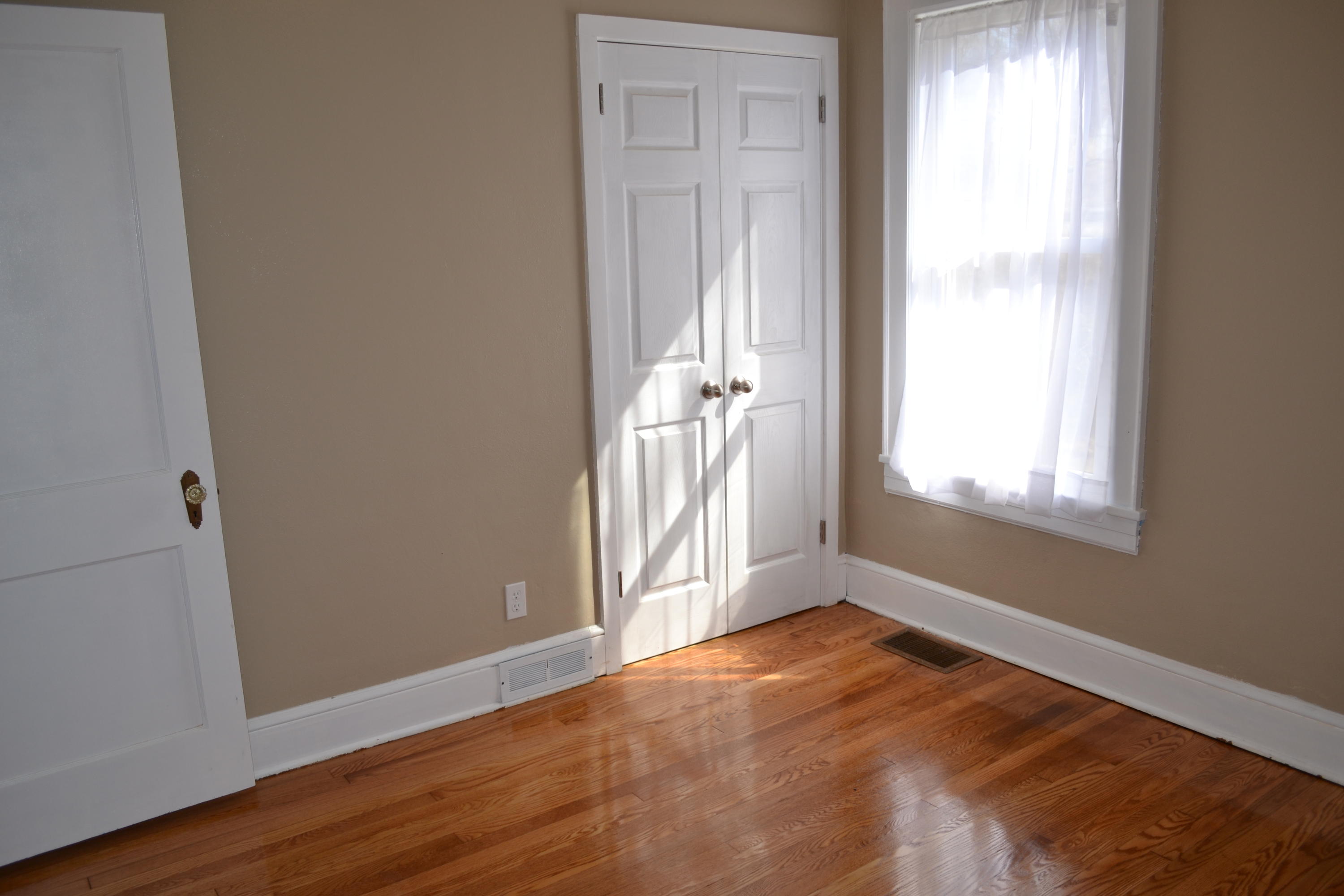 31 Mountain Pass Road Blue Ridge, VA 24064 - Photo 14 of 40 an empty room with wooden floor and windows