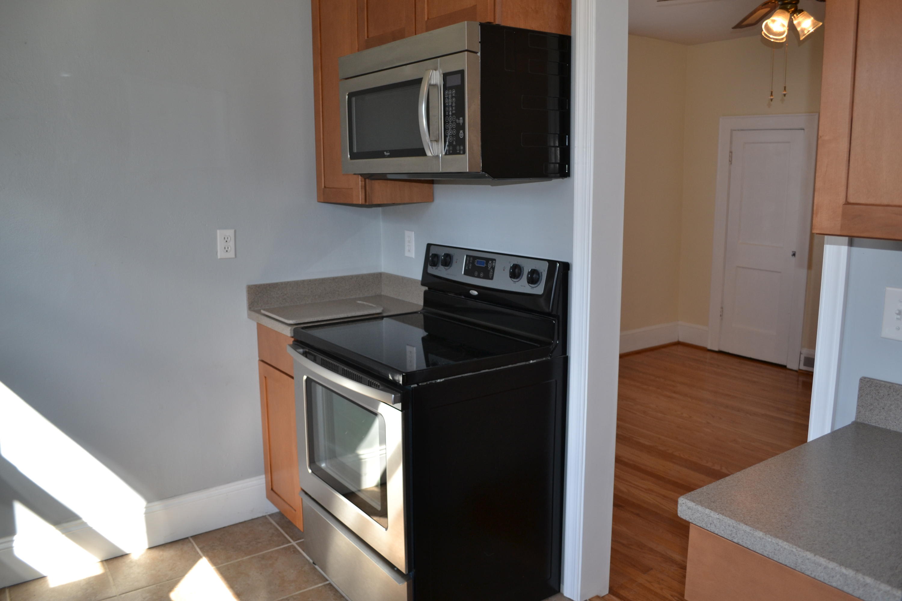 31 Mountain Pass Road Blue Ridge, VA 24064 - Photo 8 of 40 a kitchen with a stove and a microwave