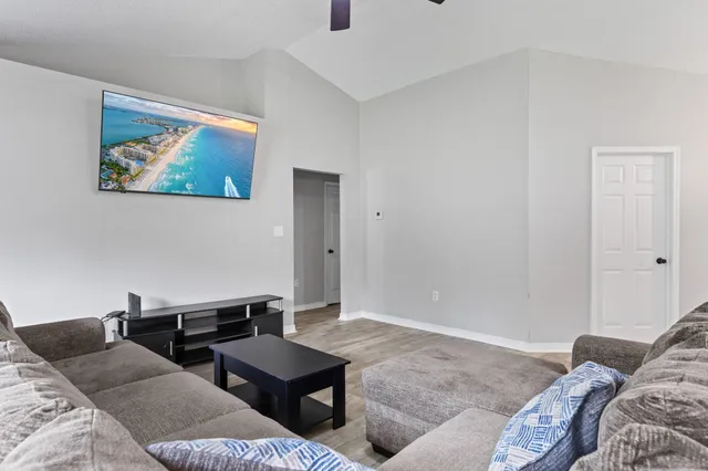 a living room with furniture and a window