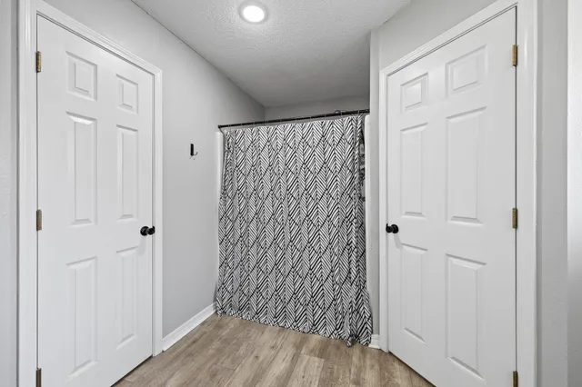 a view of entryway with wooden floor