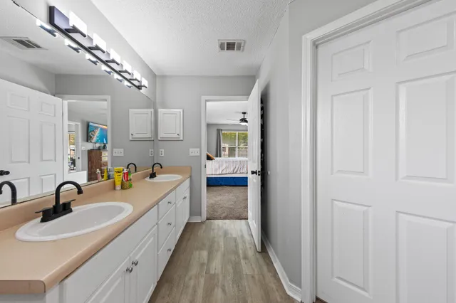 a kitchen with sink and cabinets