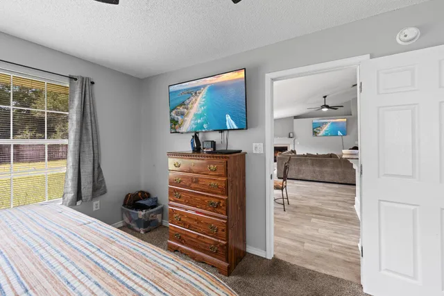 a bedroom with furniture and a window