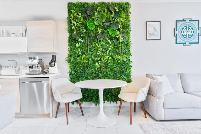 a living room with furniture and a potted plant