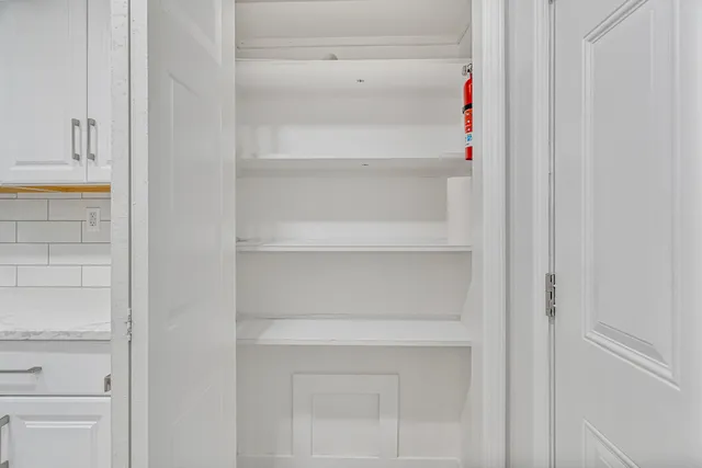 a bathroom with double sink and a mirror