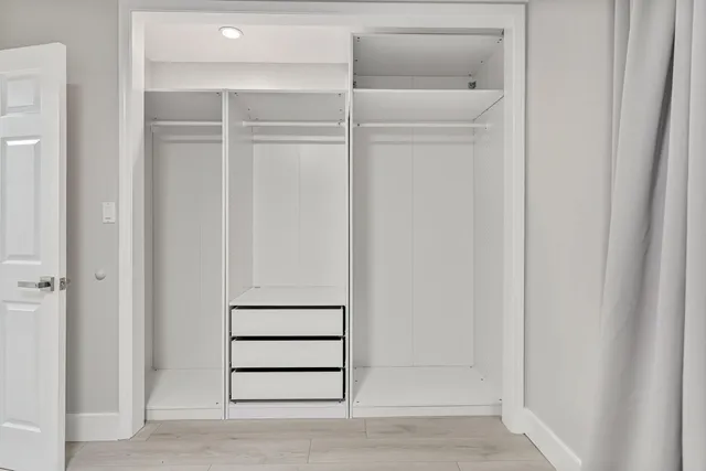 a bathroom with a bathtub and shower