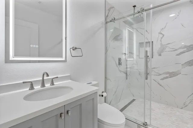 a view of a backyard with large trees