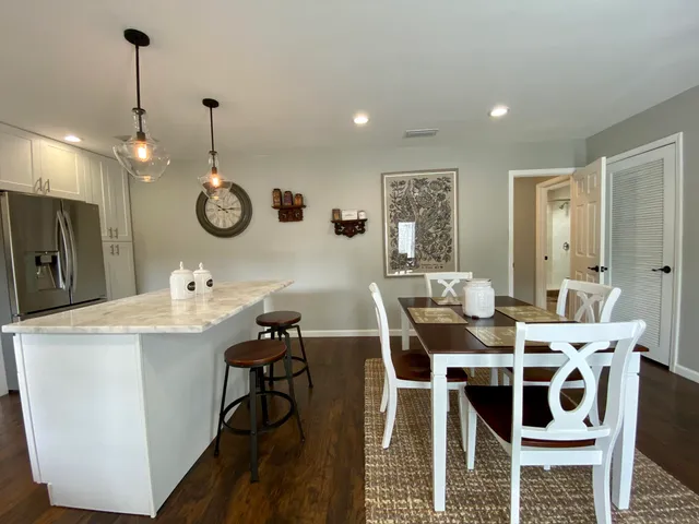 a view of a dining room and a table and chairs