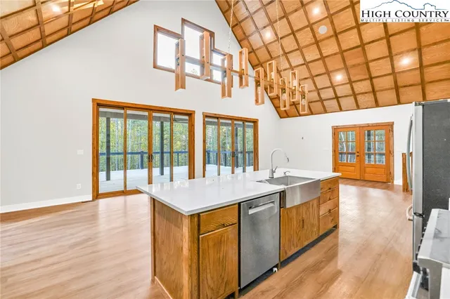a very nice looking room with kitchen view and a large window