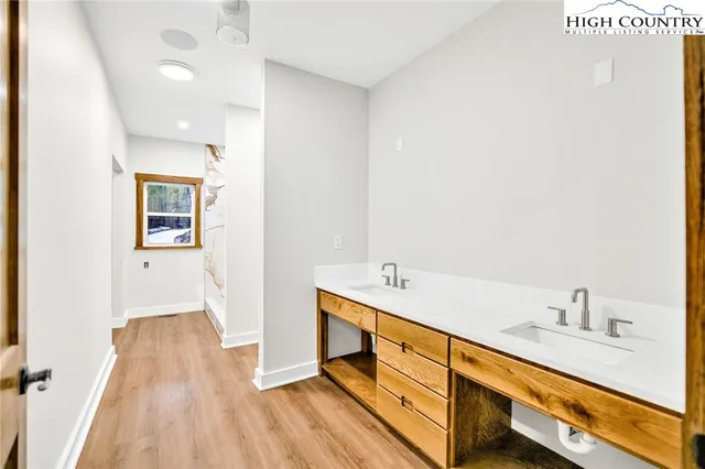 a bathroom with a sink and a mirror