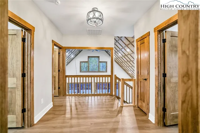 a view of an entryway with wooden floor