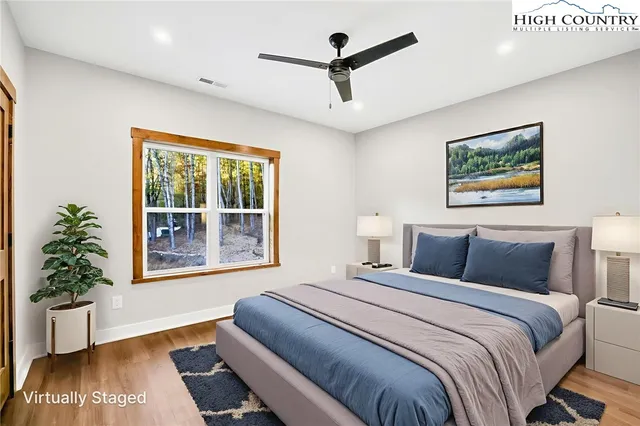 a bedroom with a large bed and a window