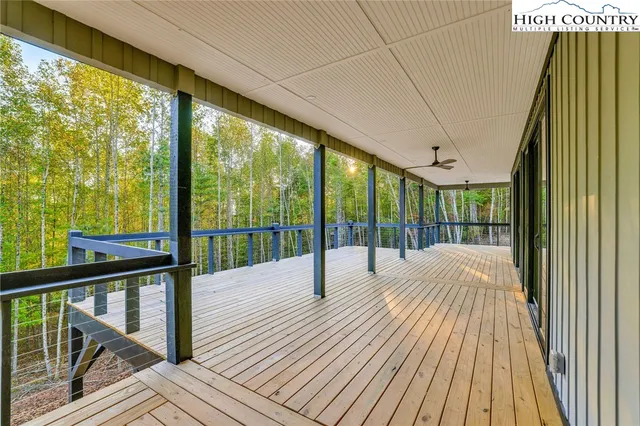 a view of balcony with wooden floor
