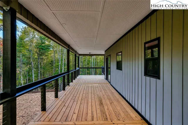 a view of balcony with wooden floor