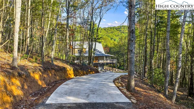 a view of a house with backyard porch and sitting area