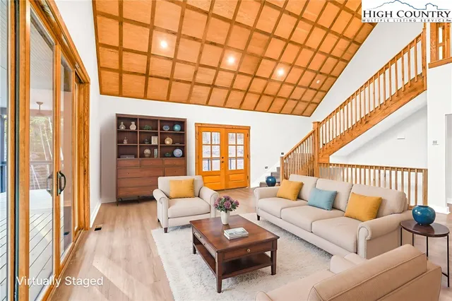 a living room with furniture and a table