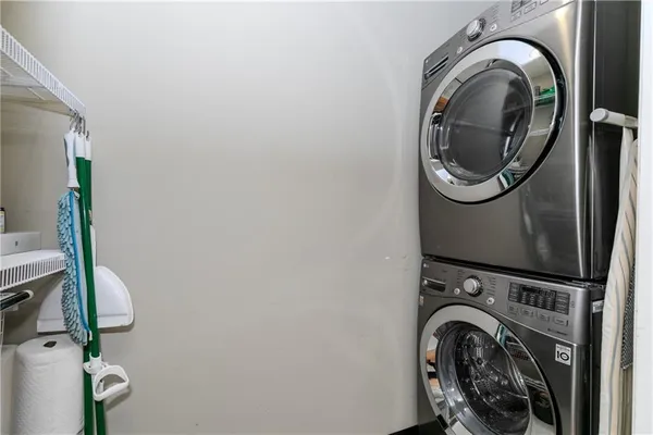 a view of a storage & utility room with a washer dryer