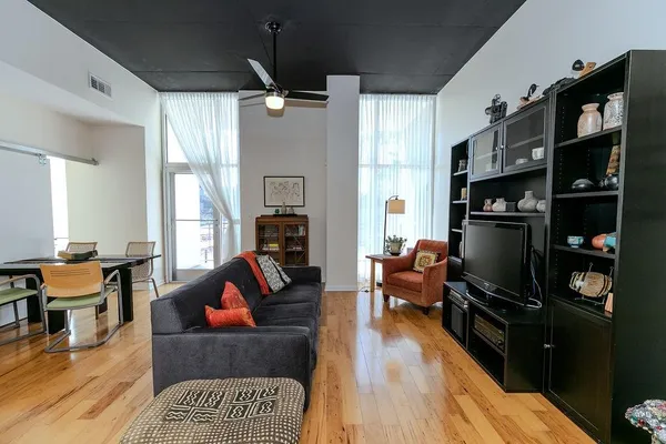 a living room with furniture fireplace and a flat screen tv