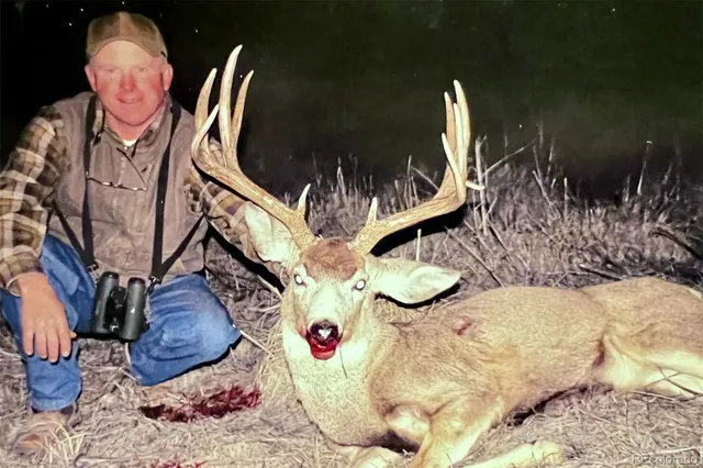 a kitchen with a sink and mirror