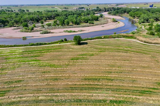 a view of a field with a lush green field
