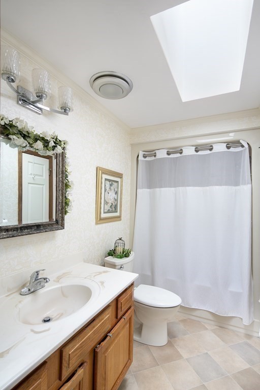 39 Shufelt Road Walpole, MA 02071 - Photo 12 of 33 a bathroom with a sink a toilet and a mirror