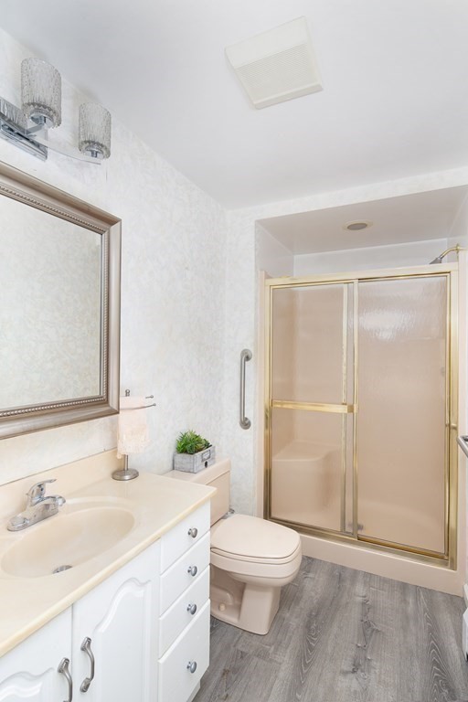 39 Shufelt Road Walpole, MA 02071 - Photo 22 of 33 a bathroom with a sink a toilet and shower