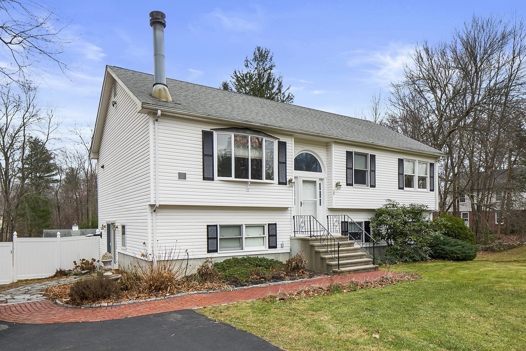 39 Shufelt Road Walpole, MA 02071 - Photo 29 of 33 a front view of a house with a garden and plants