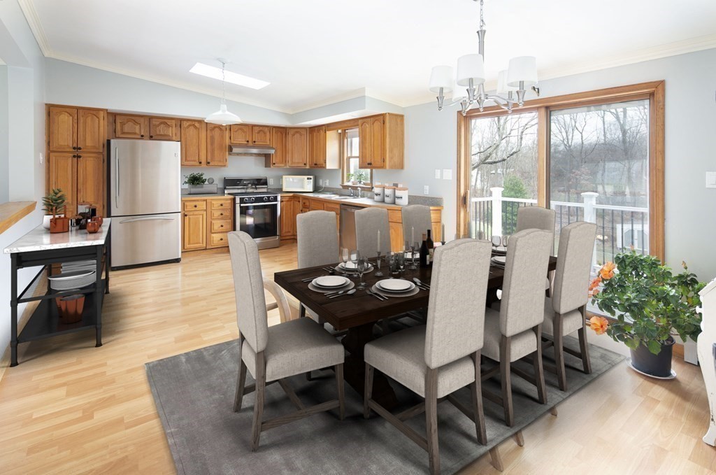 39 Shufelt Road Walpole, MA 02071 - Photo 3 of 33 a dining room with furniture a chandelier and wooden floor