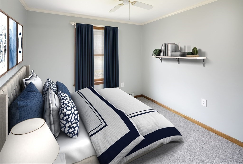 39 Shufelt Road Walpole, MA 02071 - Photo 7 of 33 a bedroom with a bed lamp and a large window