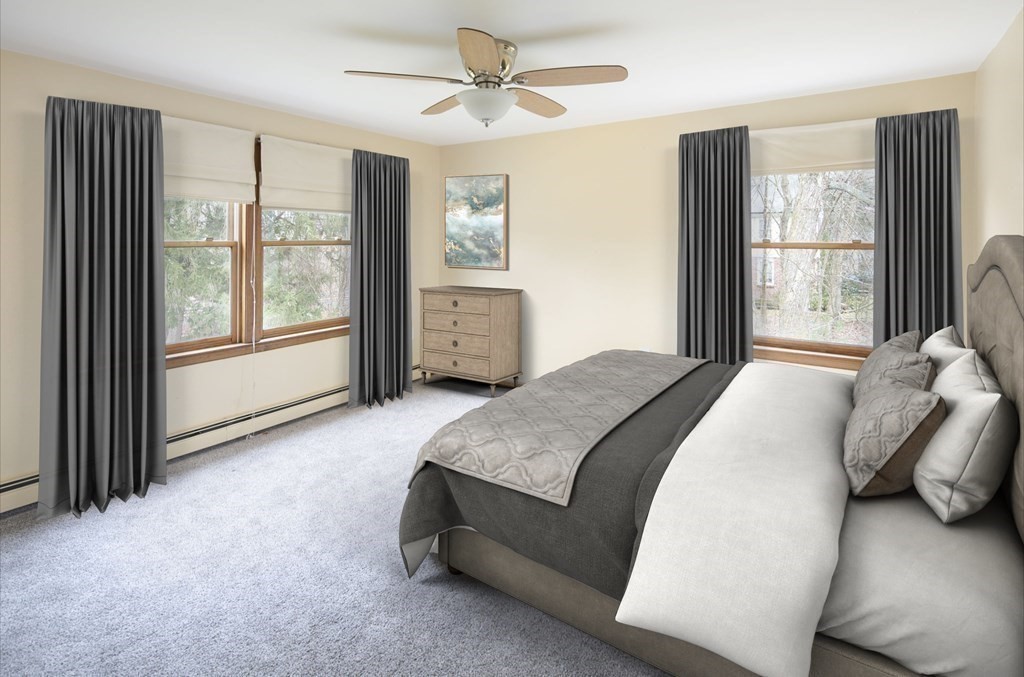 39 Shufelt Road Walpole, MA 02071 - Photo 8 of 33 a spacious bedroom with a large bed and a large window