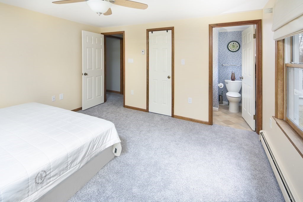 39 Shufelt Road Walpole, MA 02071 - Photo 9 of 33 a bedroom with a bed and a walk in closet