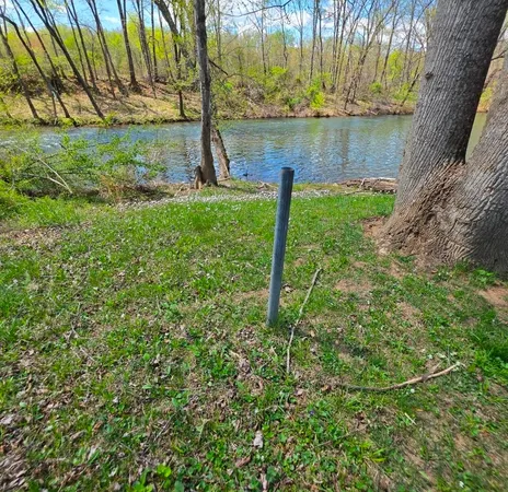 a view of a lake with a big yard