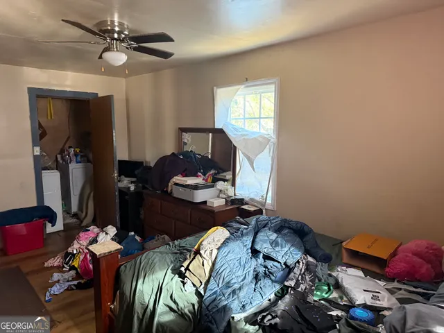 a bed room with a bed and a chandelier